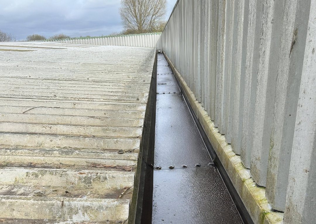 Deteriorating gutter on the Dorset industrial unit before refurbishment